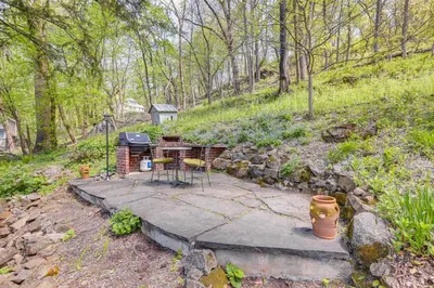 a patio with a grill and a table and chairs at Lambertville Retreat - Walk to Shopping and Dining! in Lambertville