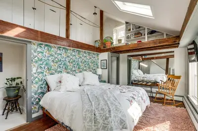 a bedroom with a large bed in a room at Lambertville Retreat - Walk to Shopping and Dining! in Lambertville