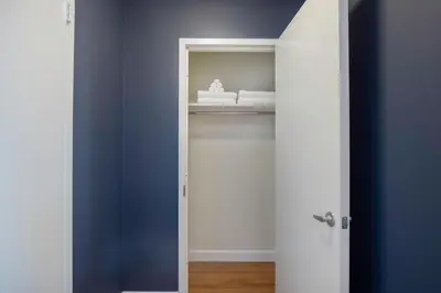 a blue and white door with a statue in a room at Theater District Studio w Indoor pool NYC-142 in New York