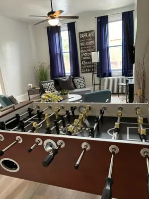 a living room with a large pool table at CONSHOHOCKEN: Quality & Location in Conshohocken