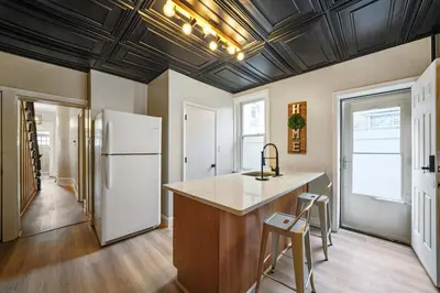 a kitchen with a white refrigerator and a counter at CONSHOHOCKEN: Quality & Location in Conshohocken