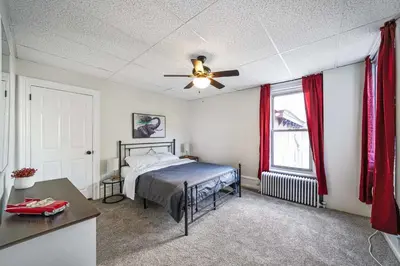 a bedroom with a bed and a ceiling fan at CONSHOHOCKEN: Quality & Location in Conshohocken