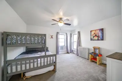 a bedroom with a bunk bed and a ceiling fan at CONSHOHOCKEN: Quality & Location in Conshohocken