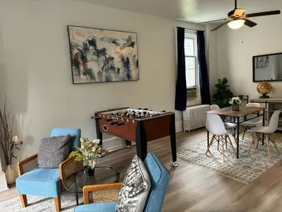 a living room with a chess table and chairs at CONSHOHOCKEN: Quality & Location in Conshohocken