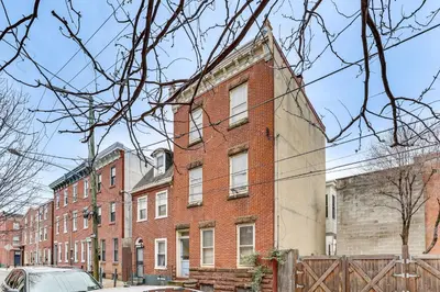 an old brick building on a city street at MCM-Inspired Philadelphia Apartment Private Deck in Philadelphia