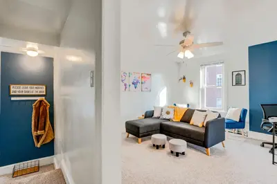 a living room with a couch and a chair at Charming Pottstown Apartment - Walk to Town! in Pottstown