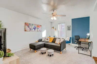 a living room with a couch and a table at Charming Pottstown Apartment - Walk to Town! in Pottstown