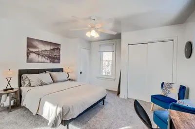 a bedroom with a bed and a ceiling fan at Charming Pottstown Apartment - Walk to Town! in Pottstown