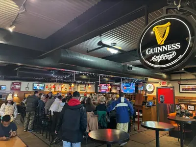 a crowd of people standing in a restaurant at The Flying Dutchman Cottage in amenities filled Masthope community Ski Big Bear in Lackawaxen