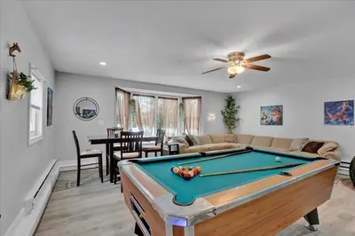 a living room with a pool table at Cabin in Long Pond Gameroom Pool Table in Long Pond