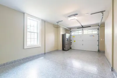 an empty garage with a refrigerator and a window at The Queen Place - Updated-Private Backyard in Gordonville
