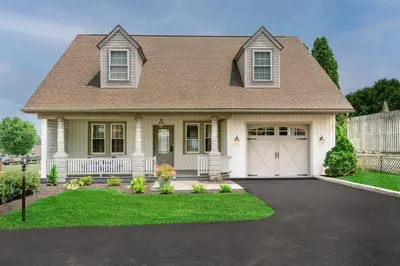a house with a white fence and a garage at The Queen Place - Updated-Private Backyard in Gordonville