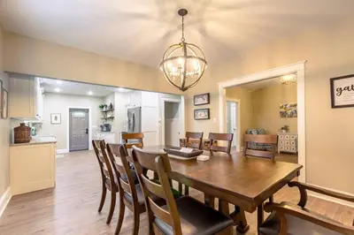 a dining room and kitchen with a table and chairs at The Queen Place - Updated-Private Backyard in Gordonville