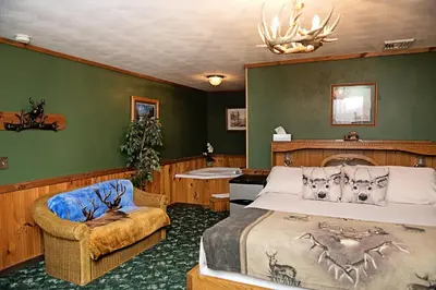 a bedroom with a bed and a chair at Berry Patch BnB in Lebanon
