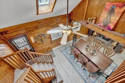 an overhead view of a living room with a table and chairs at Log Cabin and Guest House Sleeps 18 2 Game Rooms in Long Pond