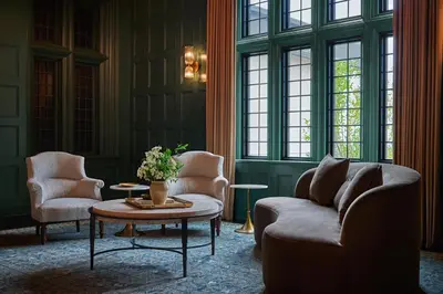 a living room with a couch and two chairs and a table at Pendry Natirar in Peapack