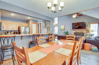 a dining room and kitchen with a table and chairs at Cozy Cove Near Waterparks, Zip Line, Ski and More in Tannersville