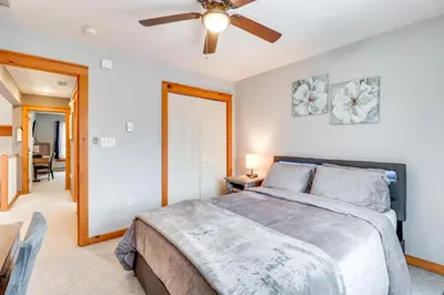 a bedroom with a bed and a ceiling fan at Cozy Cove Near Waterparks, Zip Line, Ski and More in Tannersville