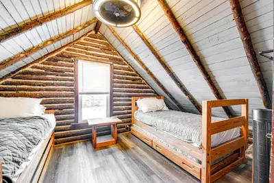 a bedroom with two beds in a log cabin at Easy Interstate Access Original Poconos Log Cabin in Blakeslee