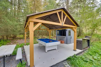 a gazebo with a ping pong table at Private Hot Tub Poconos Babbling Brooke Cottage in Blakeslee
