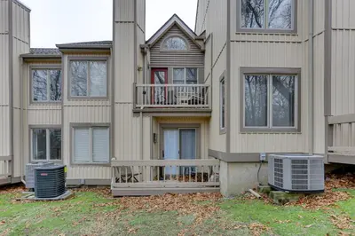 a house with two air conditioners in front of it at East Stroudsburg Townhouse Less Than 1 Mi to Ski Area! in East Stroudsburg