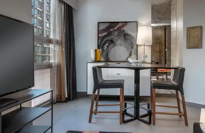 a living room with a table and two chairs at Hyatt Herald Square New York in New York