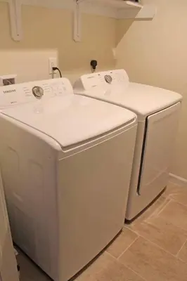 a white washer and dryer in a room at Luxury 6 BR Rebel Ridge Retreat-Sleeps 16-Hot Tub & Linens Included in Albrightsville