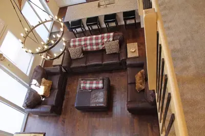 an overhead view of a living room with leather furniture at Luxury 6 BR Rebel Ridge Retreat-Sleeps 16-Hot Tub & Linens Included in Albrightsville
