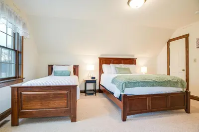 a bedroom with two beds and a window at 4 Mi to the Amish Village Spacious Home with Deck! in Ronks