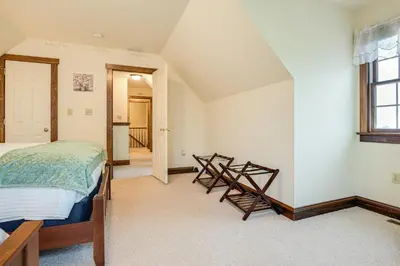 a bedroom with a bed and a window at 4 Mi to the Amish Village Spacious Home with Deck! in Ronks