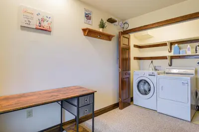 a laundry room with a washer and dryer at 4 Mi to the Amish Village Spacious Home with Deck! in Ronks