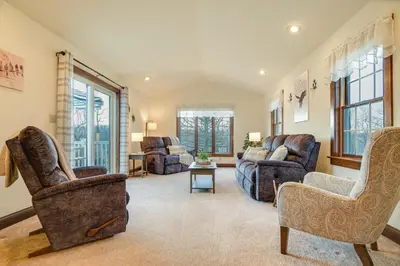 a living room with two chairs and a couch at 4 Mi to the Amish Village Spacious Home with Deck! in Ronks