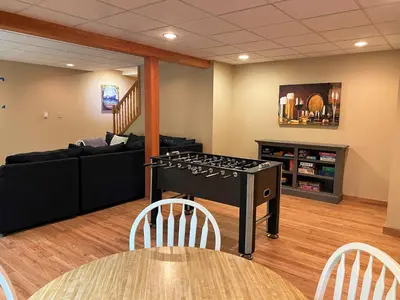 a living room with a stove and a couch at Gorgeous House in Camelback Mountain near lifts! in Tannersville