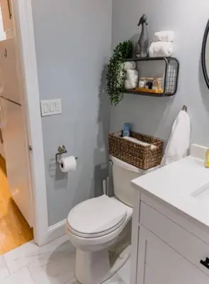 a bathroom with a white toilet and a sink at New Beautiful Apartment In Bayonne near Subway Path Train Manhattan NYC in Bayonne