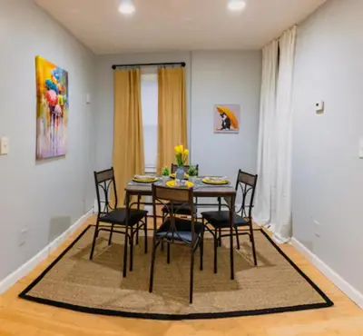 a dining room with a table and chairs at New Beautiful Apartment In Bayonne near Subway Path Train Manhattan NYC in Bayonne