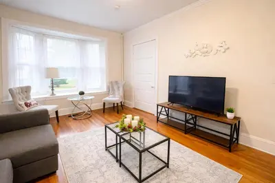 a living room with a large flat screen tv at Spacious 2-Bedroom Near Elkins Park, Monthly Disco in Elkins Park