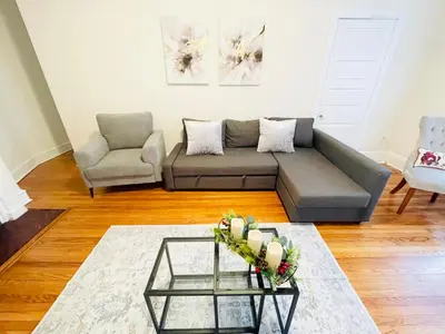 a living room with a couch and a table at Spacious 2-Bedroom Near Elkins Park, Monthly Disco in Elkins Park