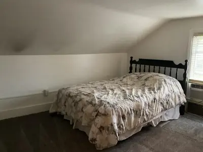 a bedroom with a bed with a comforter on it at Amish Country Stay w/ Buggy Ride in Gap