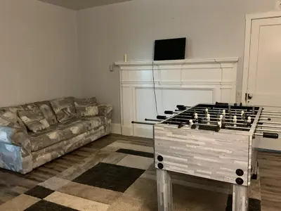 a living room with a couch and a chess board at Amish Country Stay w/ Buggy Ride in Gap