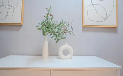 two white vases sitting on top of a table at Chic 3Bd NoMad Manhattan in New York