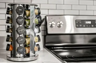 a spice dispenser sitting next to a stove at Cozy Apt in Center City! in Philadelphia
