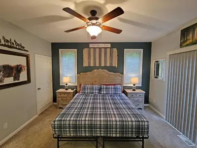 a bedroom with a bed and a ceiling fan at 5 BR Coyote Cliff Corner HUGE Luxury w/Hot Tub and Linens in Albrightsville