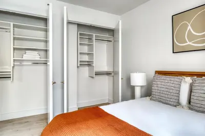 a bedroom with a bed and a closet at Brooklyn Heights 2br w elevator wd NYC-1066 in Brooklyn