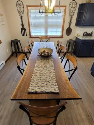a dining room table with chairs and a bowl on it at Red Rock Run - Luxury 6 BR Secluded Home with Hot Tub & Linens in Albrightsville