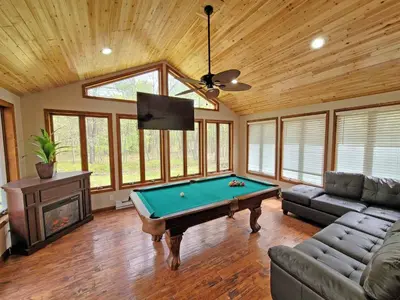 a living room with a pool table in it at Red Rock Run - Luxury 6 BR Secluded Home with Hot Tub & Linens in Albrightsville