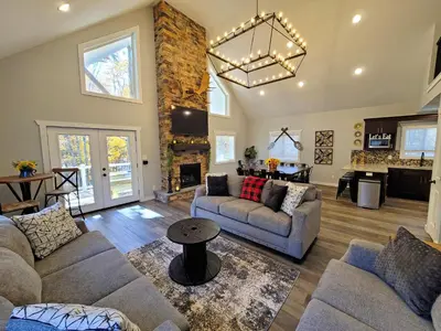 a living room with two couches and a fireplace at Timber Top Terrace - Huge Luxury 6 BR - Sleeps 16 Linens and Towels Included in Albrightsville
