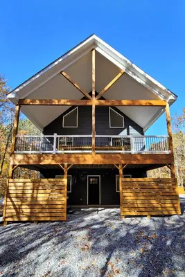 a large house with a porch and a deck at Timber Top Terrace - Huge Luxury 6 BR - Sleeps 16 Linens and Towels Included in Albrightsville