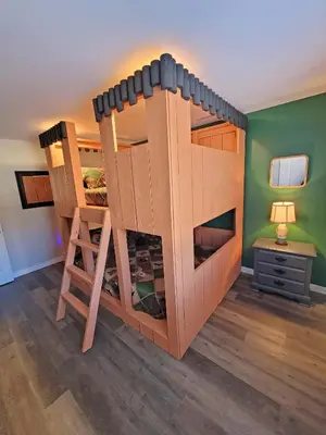 a large wooden bunk bed in a room at Timber Top Terrace - Huge Luxury 6 BR - Sleeps 16 Linens and Towels Included in Albrightsville