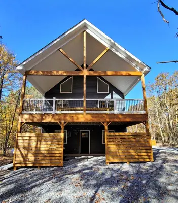 a large house with a gambrel roof at Timber Top Terrace - Huge Luxury 6 BR - Sleeps 16 Linens and Towels Included in Albrightsville