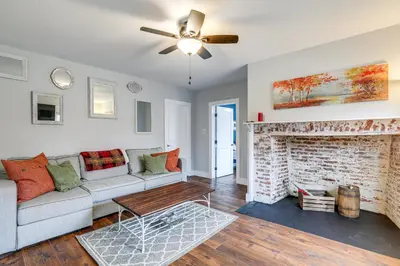 a living room with a couch and a fireplace at In-Town and Walkable Historic Yardley Retreat! in Yardley
